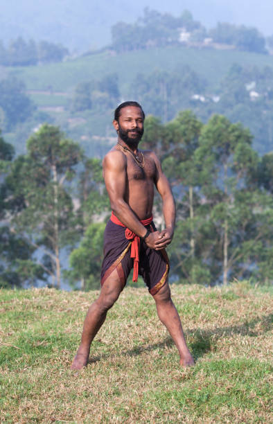 istock Indian man doing yoga exercises on green grass 960255700