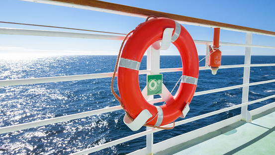 Red life beld at stern of passenger ship - safety equipment