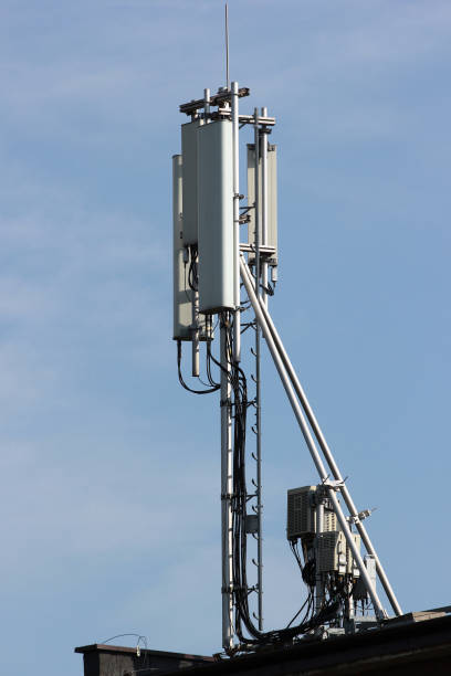 istock Cell antenna on a roof against blue sky background 960265272