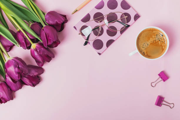 istock Flat lay on pink background with tulips and coffee 960268304