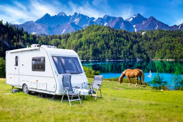 Vacation in Poland - camper trailer by the Czorsztyn lake and Tatra Mountains landscape