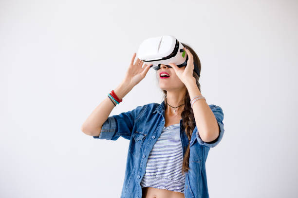 istock Young woman with VR glasses in studio 960274282