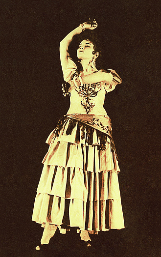 Vintage sepia toned photo of a young spanish flamenco dancer from the sixties of the twentieth century.