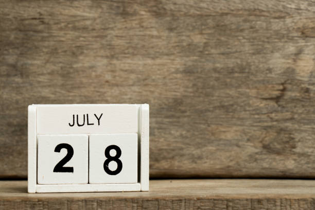 istock White block calendar present date 28 and month July on wood background 960281152