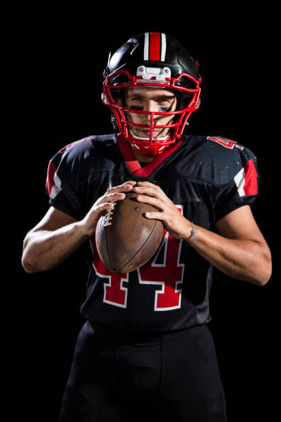 istock Football player portrait on black background 960281730