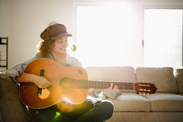 istock Woman playing guitar and enjoying 960282108