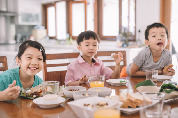 istock asian chinese family at dining room having breakfast 960282584