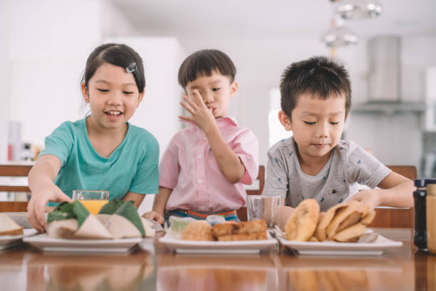 istock asian chinese family at dining room having breakfast 960282586