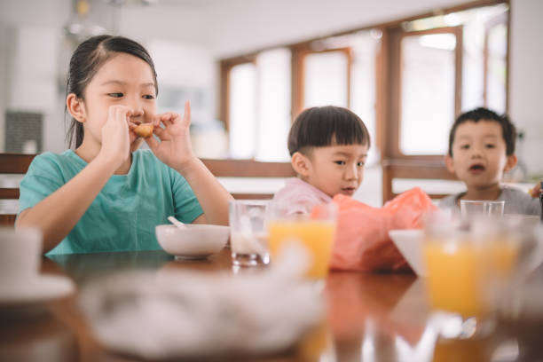 istock asian chinese family at dining room having breakfast 960285084