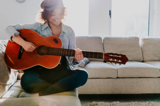 istock Woman playing guitar and enjoying 960285466
