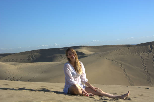 istock The woman in the desert dunes 960285974