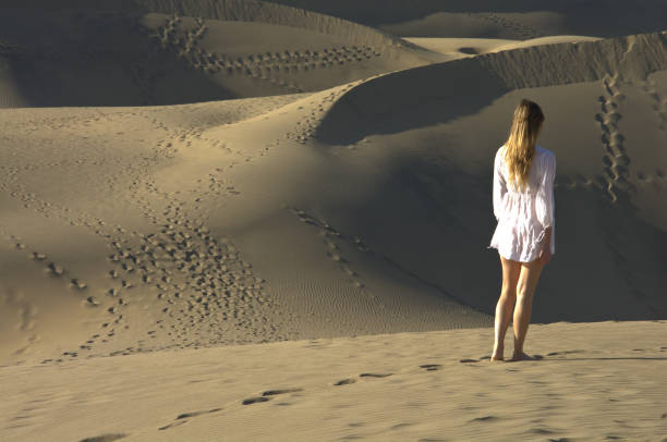 The woman in the desert dunes Travelling to Middle East gaza strip photos stock pictures, royalty-free photos & images
