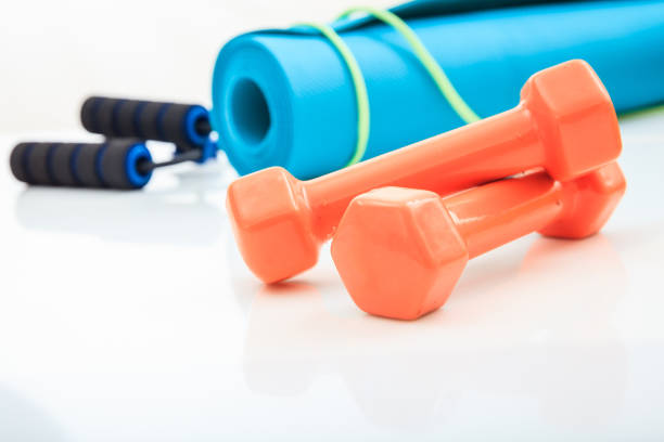 istock Yoga mat and dumbbells on white background 960287108