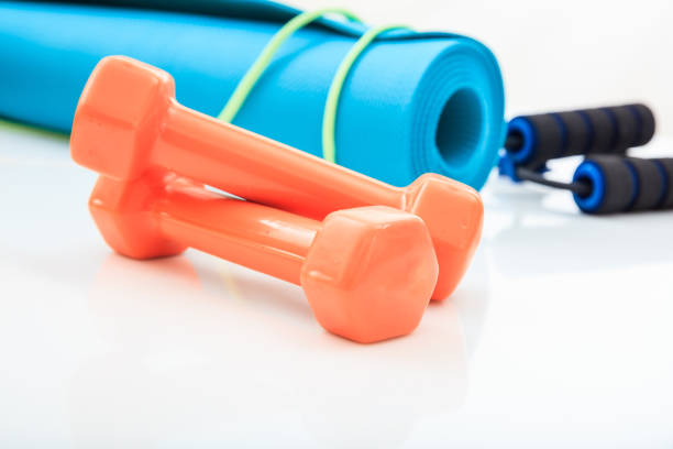 istock Yoga mat and dumbbells on white background 960287188