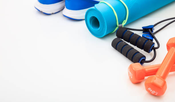 istock Yoga mat and dumbbells on white background 960287256