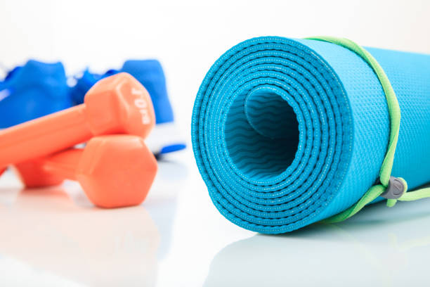 istock Yoga mat and dumbbells on white background 960287490