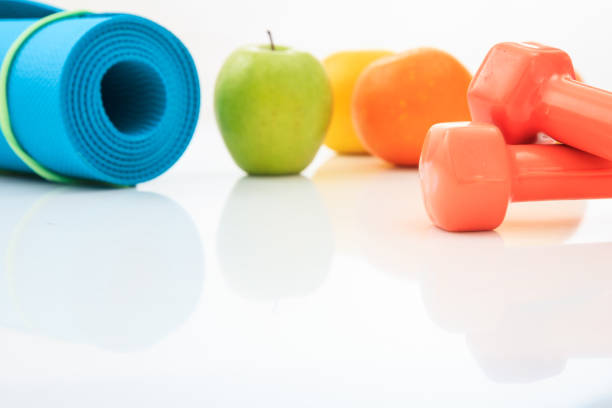 istock Yoga mat and dumbbells on white background 960289718
