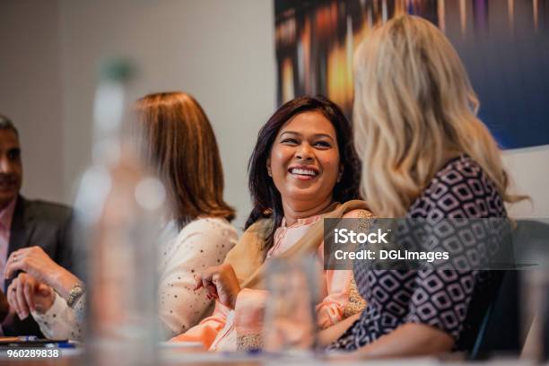 Businesswomen Talking Before A Meeting Stock Photo - Download Image Now - Discussion, Talking, Women