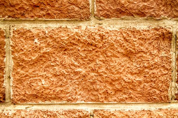 istock Abstract Autumn maple background of tile brick wall. Texture surface of stone wall 960291262