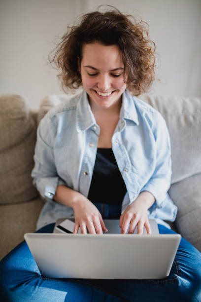 istock Woman using credit card to purchase merchandise on internet 960294216