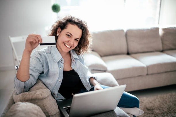 istock Woman using credit card to purchase merchandise on internet 960294604