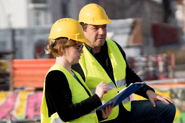 istock Male and female coworkers on construction site 960295866