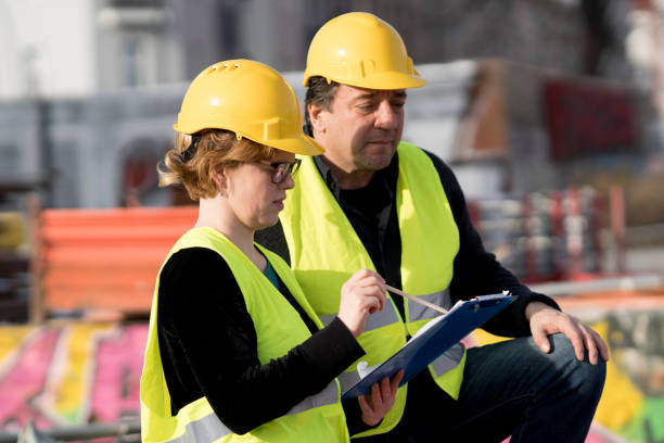istock Male and female coworkers on construction site 960295868
