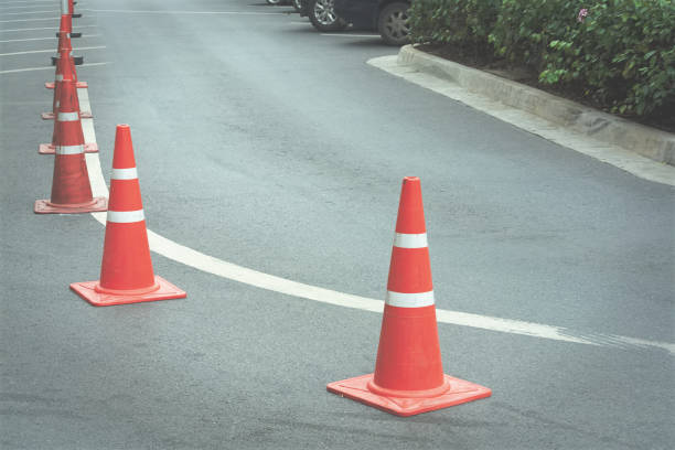 istock Group of Orange Traffic Cones on Curved Road 960298256