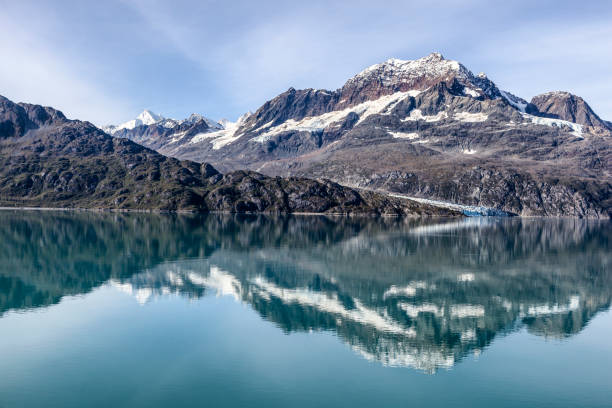Cruising through Alaska's Glacier Bay National Park. Lamplugh Glacier, summer.