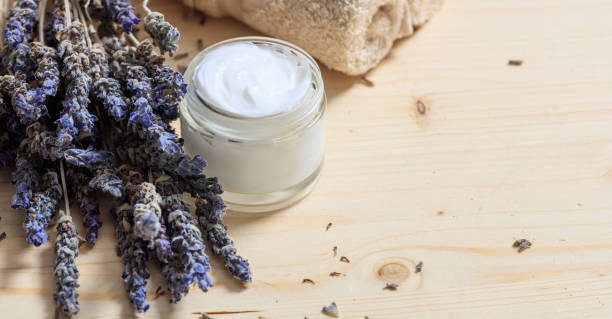 istock Moisturizing cream and lavender on wooden background 960305756