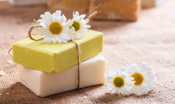 istock Natural handmade soap bars and chamomile on wooden background 960306240