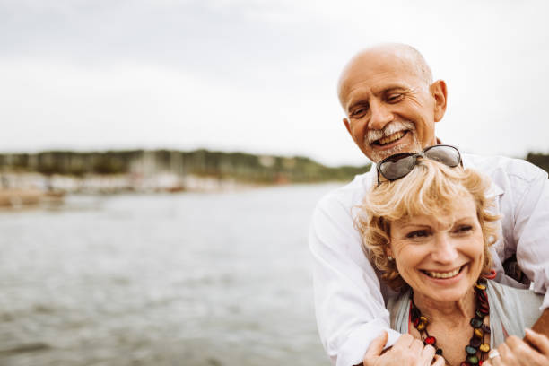 istock senior couple embraced at the seaside 960311326