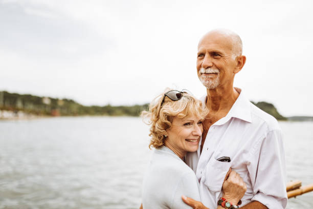 istock senior couple embraced at the seaside 960311330