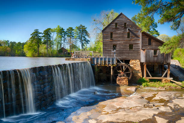 Historic Yates Water Mill Historic Yates Water Mill in Raleigh, North Carolina watermill stock pictures, royalty-free photos & images