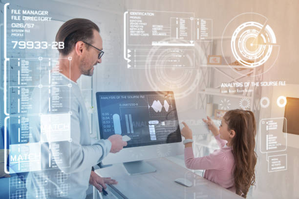 istock Clever girl holding a modern device while learning to use it 960317402