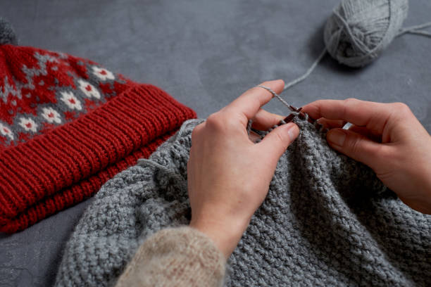 istock Close-up of hands knitting. 960326804