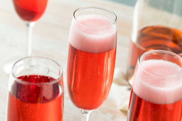 Sweet homemade Rose Mimosas Sweet homemade Rose Mimosas with Berry Syrup rose champagne stock pictures, royalty-free photos & images