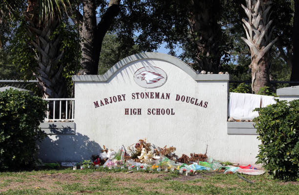 Marjory Stoneman Douglas High School in Parkland Florida Parkland, Florida, USA - April 25, 2018: The Marjory Stoneman Douglas High School in Parkland, Florida. The school was the site of a school shooting in 2018 which set off mass protests against gun violence. gun control photos stock pictures, royalty-free photos & images