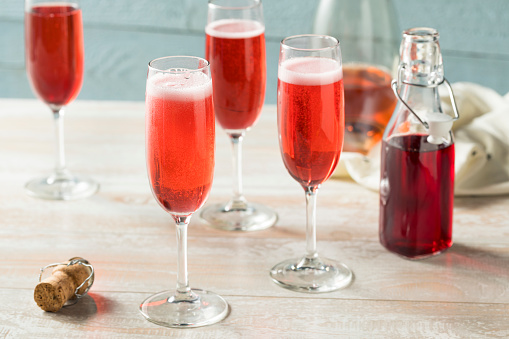 Sweet homemade Rose Mimosas with Berry Syrup