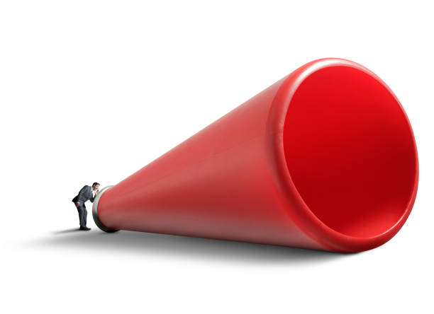 istock Businessman Shouts Into An Oversized Red Megaphone 960334558
