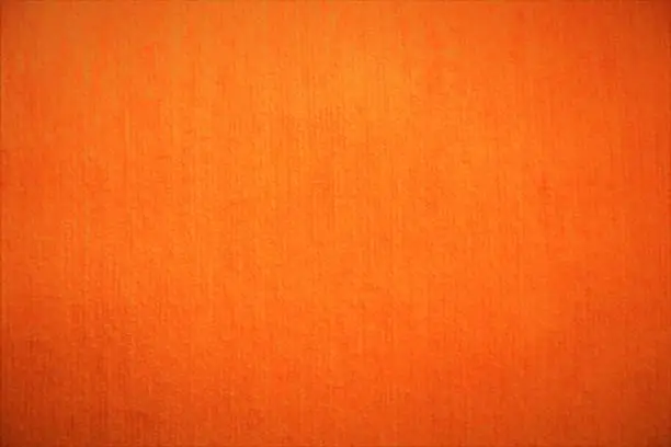 Photo of Orange textile velvet fabric fluffy background in bright soft colors