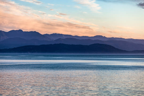 Puget Sound and Olympic Mountains at Sunset Puget Sound and Olympic Mountains, sunset in spring. puget sound stock pictures, royalty-free photos & images