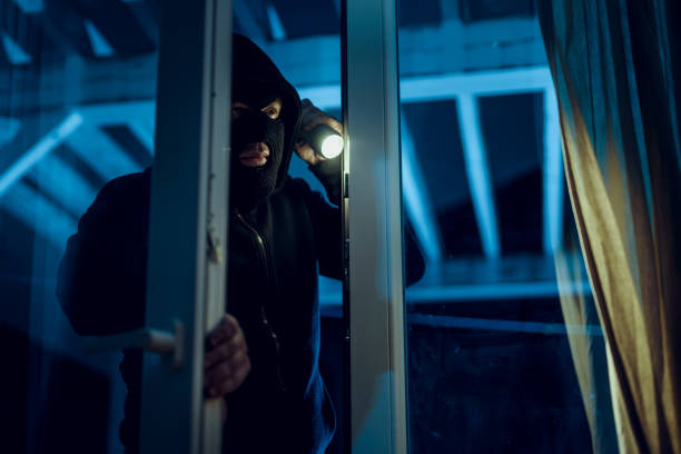 Robber Robber penetrates house burglary photos stock pictures, royalty-free photos & images
