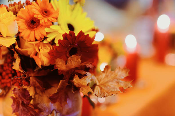 Holidays. Autumn.  Floral arrangement on beautiful wood table.  Plenty of room for text.