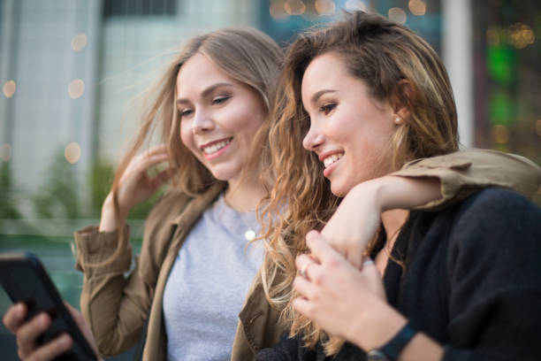 istock Happy teenagers using mobile phone. 960369902