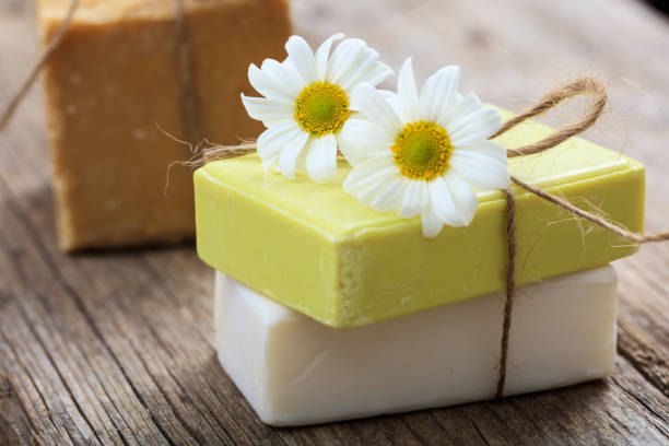 istock Natural handmade soap bars and chamomile on wooden background 960370896