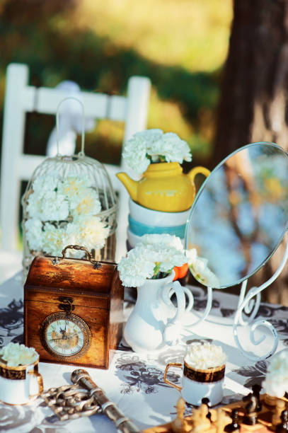 istock Holiday themed table for the tea ceremony. Table with sweets. Tea with sweets. Table of Alice in Wonderland 960371394