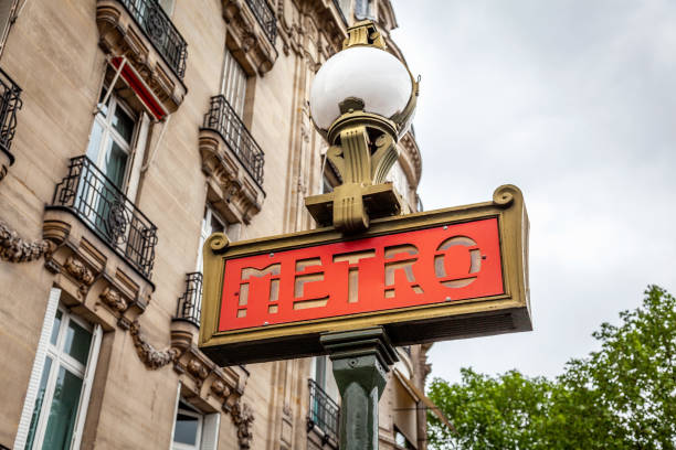 istock Paris Metro Underground Subway Sign and Apartment Building 960375038