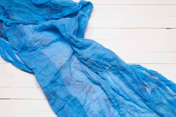 istock blue tissue on white wooden table top view 960386206