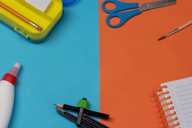 istock School supplies on 2 color flat lay background 960388468
